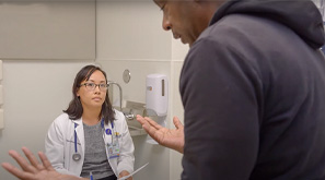 A family nurse practitioner student meets with a patient in a simulation exercise